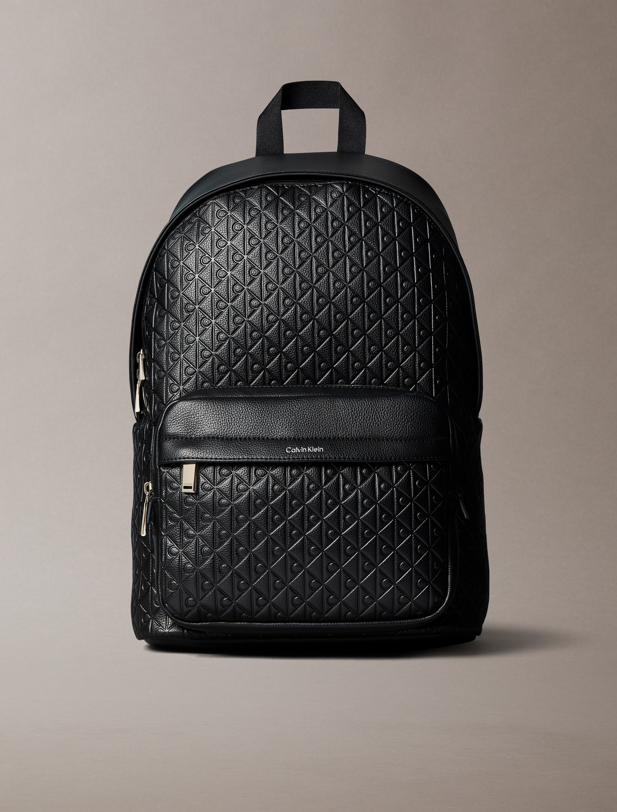 Embossed Allover Monogram Backpack