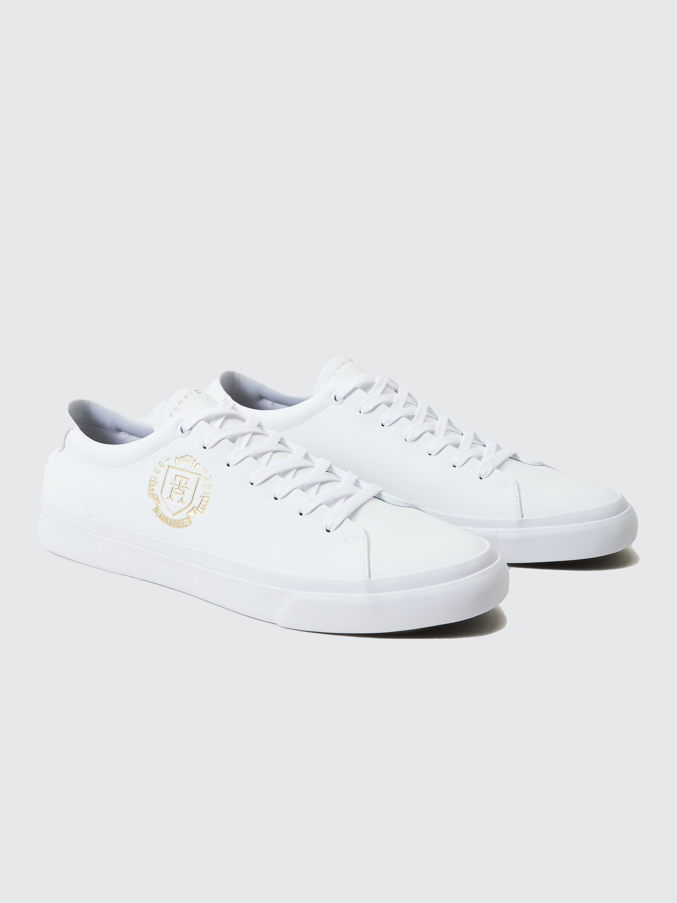 Tommy hilfiger white store and gold sneakers